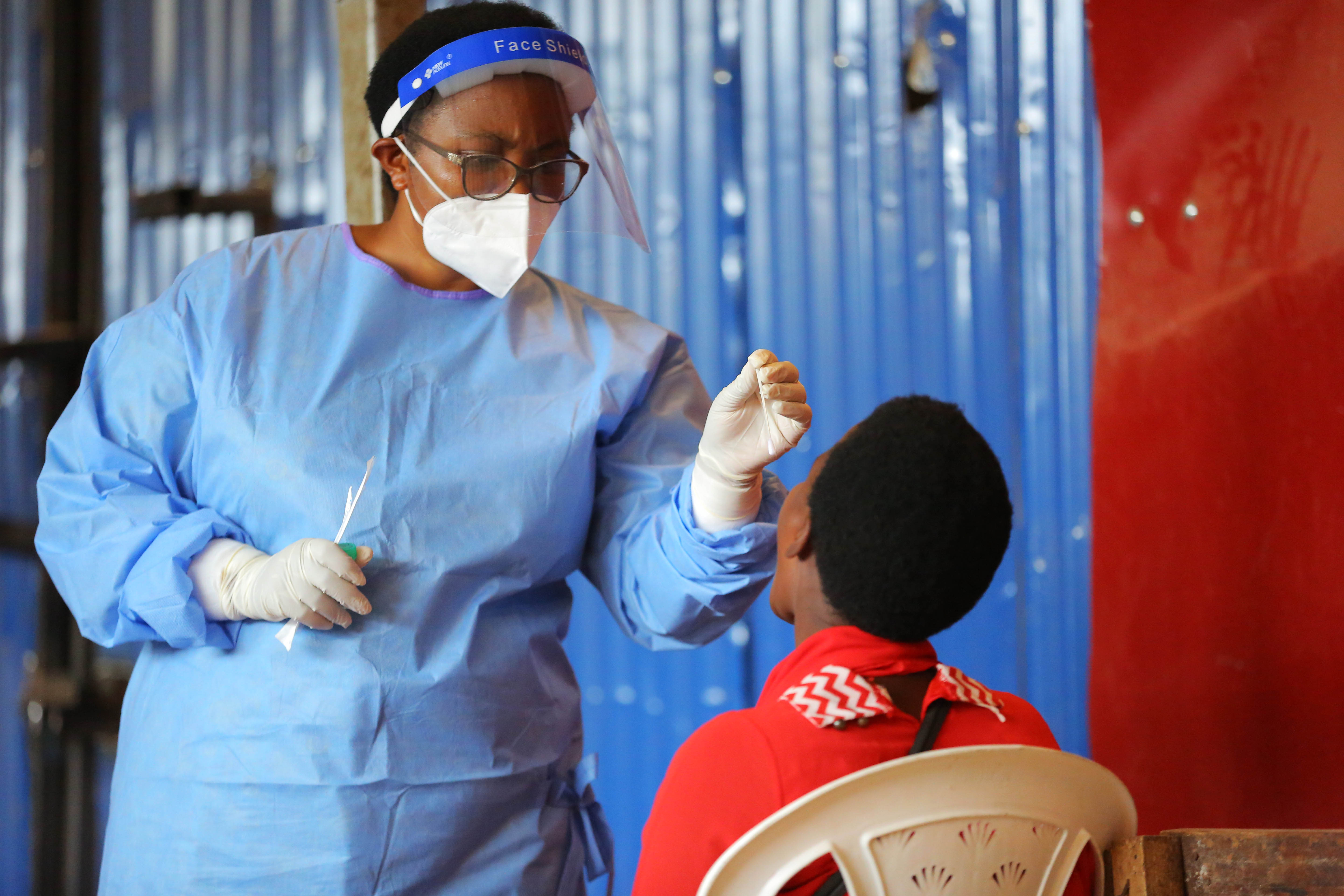 A health worker conducts a random testing of Covid-19 in Kigali. 