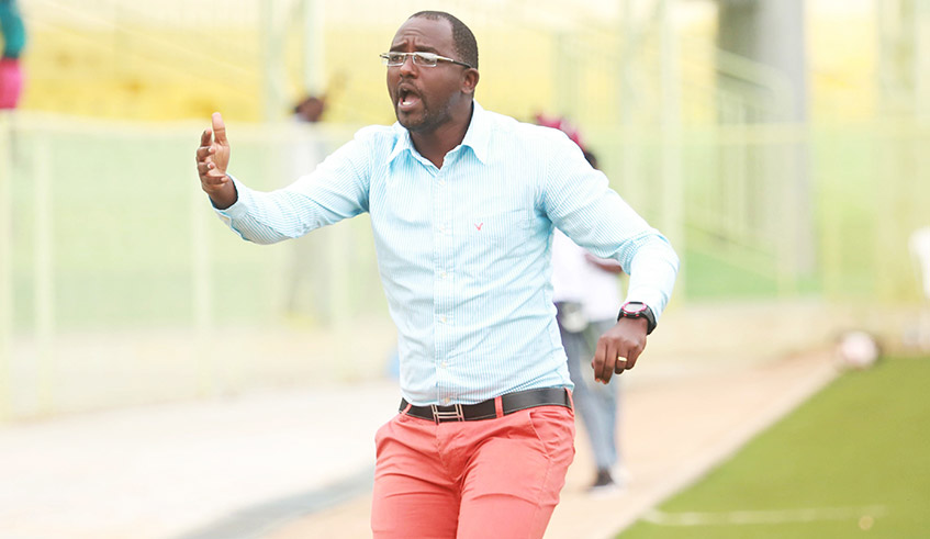 Francis Haringingo , the new SC Kiyovu head coach  gestures to his players during a past match at the Kigali Stadium . / Sam Ngendahimana