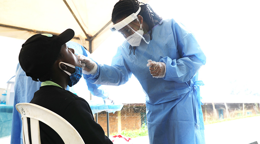 Health worker conducts Covid 19 testing exercise at Camp Kigali on January 15, 2021. 
