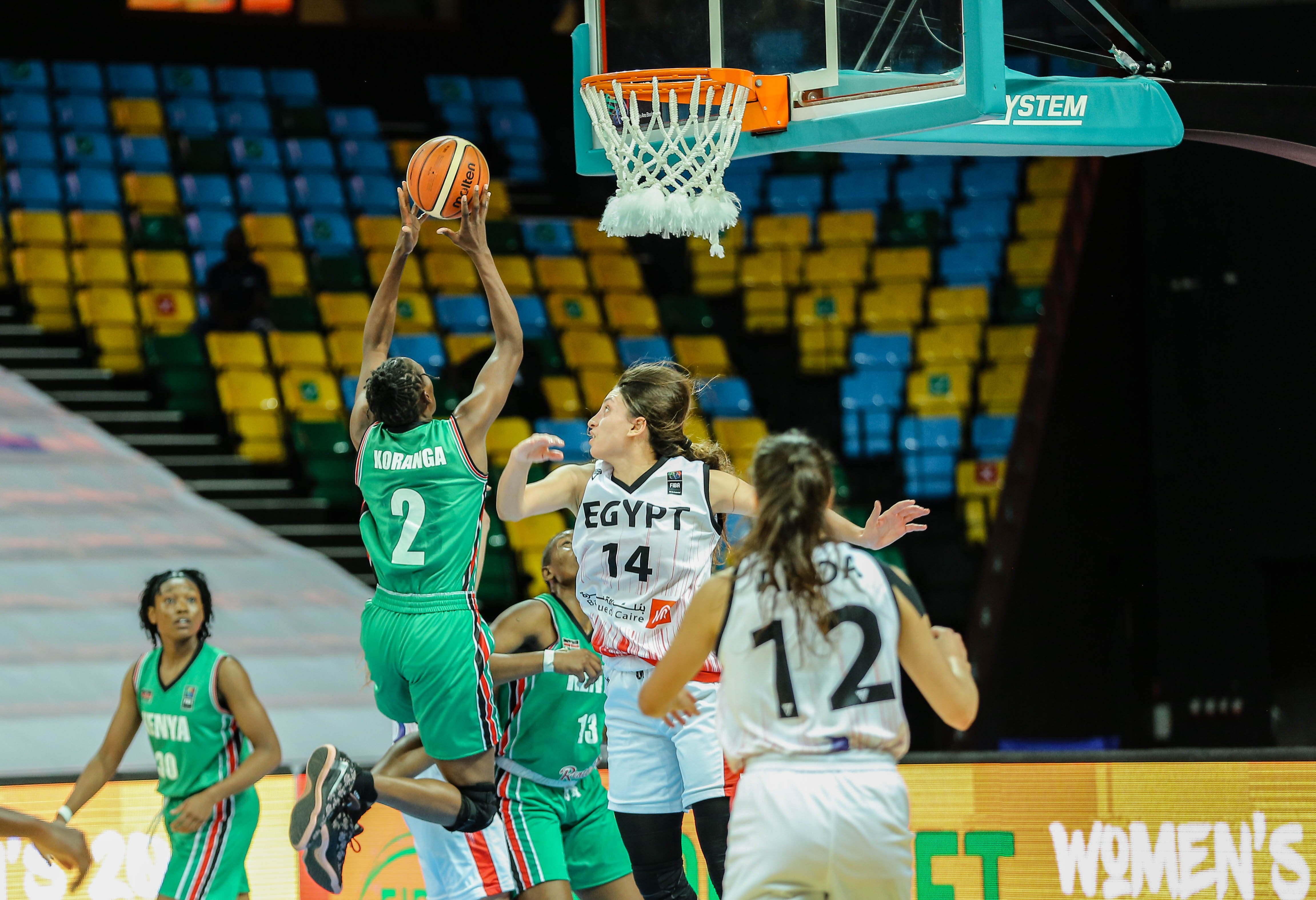 Kenyan power forward Felmas Koranga evades Egypt's defense for a throw-in during the 2021 FIBA Womenu2019s AfroBasket Zone 5 Qualifiers final at Kigali Arena. 