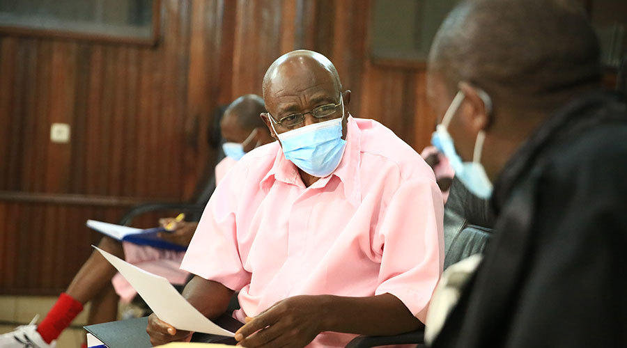 Paul Rusesabagina interacts with his lawyer Rudakemwa during the hearing at the High Court Special Chamber for International and Cross-border Crimes on March 12, 2021. / Sam Ngendahimana