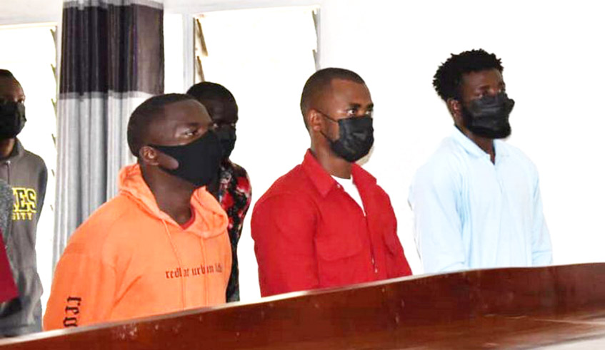 Former national football team goalkeeper Olivier Kwizera (right) and co-accused during a hearing at Kicukiro Primary Court on June 28. / Photo: Courtesy.