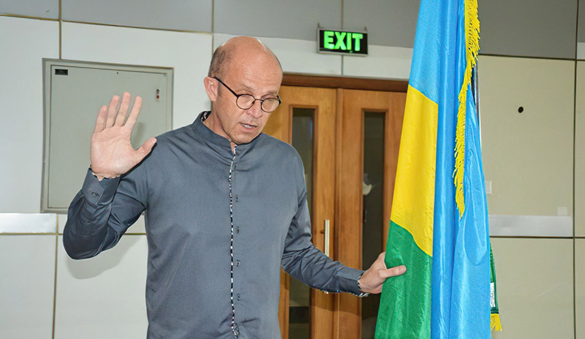 Former University of Rwanda Vice Chancellor, Scottish Prof. Philip Cotton, takes oath marking his acquisition of Rwandan citizenship at Nyarugenge District headquarters in 2019. / Photo: File.
