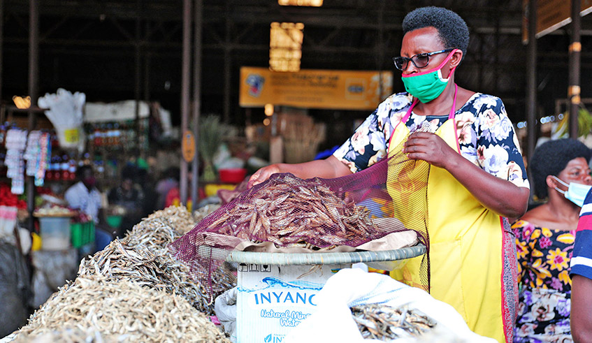 A sardine fingerlings vendor at Kimironko market last year. / Photo: Craish Bahizi.