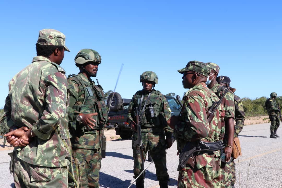 Rwanda Defense Force soldiers interact with the Mozambican army during their joint operations in fighting off IS insurgents who have terrorized the province of Cabo Delgado. 