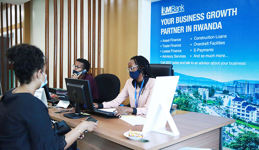 I &M Bank Rwanda staff attend to clients at Kigali Height Branch in Kimihurura last year. / Photo: Sam Ngendahimana.