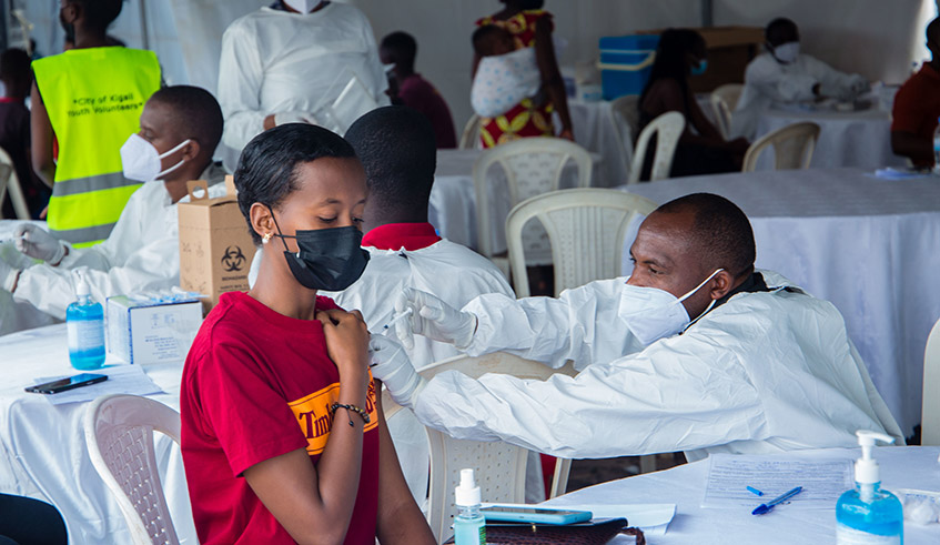 One of hundreds of  youths that get for their first dose of Covid 19 vaccine during  a vaccination campaign that targets the general population aged 18 and above at Remera on Monday ,August 23 . / Dan Nsengiyumva