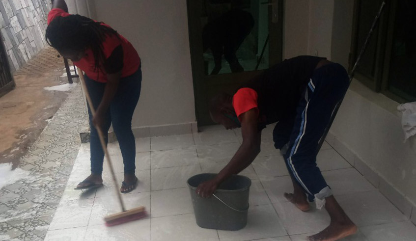 D-Runner Ltd, co-founded by Gladys Keza (circled), workers cleaning a clientu2019s home. 