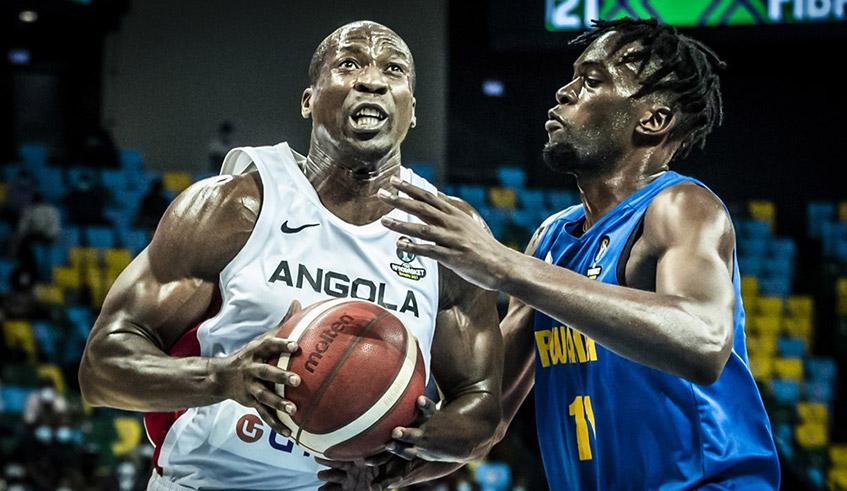 Rwanda's Axel Mpoyo (R), who was named the player of the game, defends Angolan player Eduardo Mingas during the 71-68 victory at Kigali Arena on Thursday evening. 
