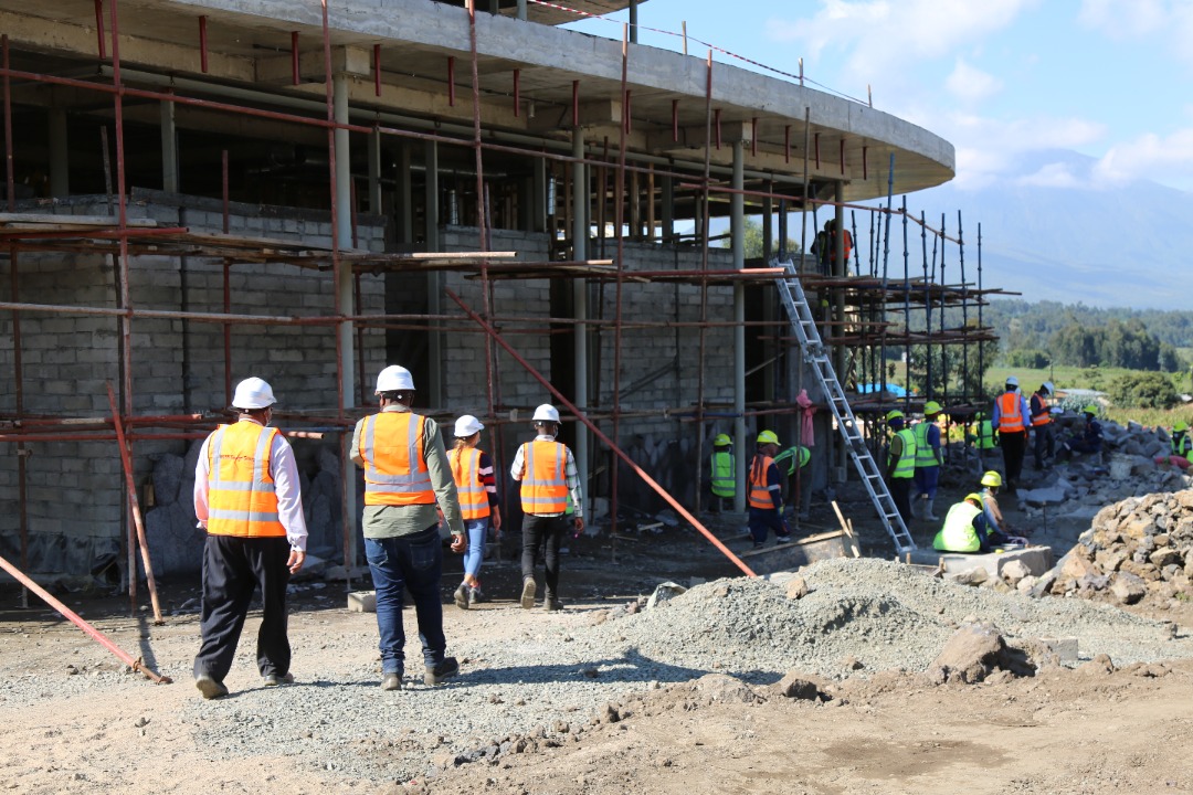 Workers during the ongoing construction activities at Ellen DeGeneres campus in Musanze in June 2021. 