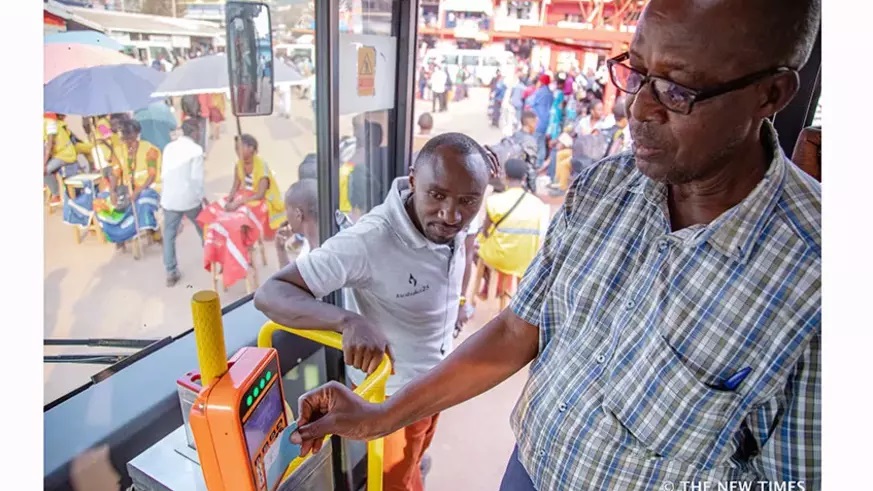 A passenger uses a Tap&Go card to board transport bus in Kigali. The adoption of digital technology increase the efficiency and effectiveness of provision for services such as health care, education, and transport. / Photo: File.