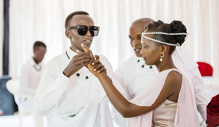 Jean de Dieu Uwukunda and Chantal Vuguziga who are both visually impaired, during their intimate wedding ceremony. Photos/Dan Nsengiyumva