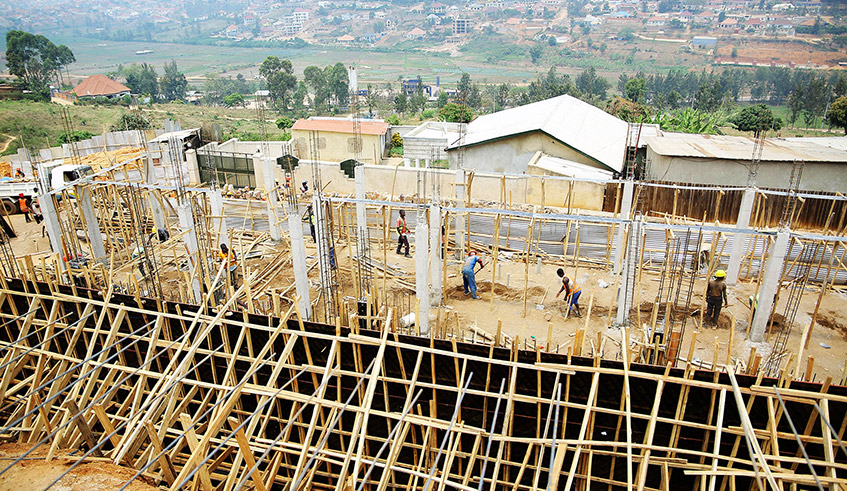 Workers during the construction activities of the centre for mental health in Kinyinya Sector in Gasabo District on August 30. / Photo: Dan Nsengiyumva.