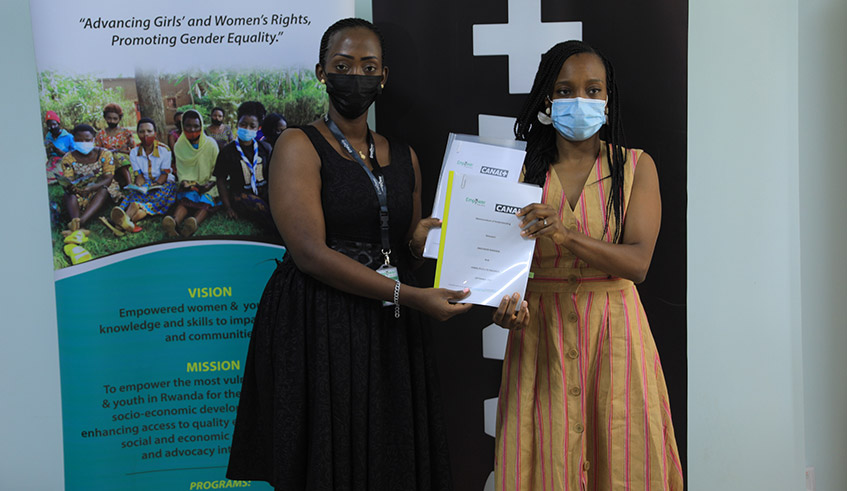 Sophie Tchachoua, Canal+ Rwanda Managing Director (right), and Olivia Promise Kabatesi, Country Director ofEmpower Women Rwanda, pose with the signed MoU in Kigali on Thursday, September 2. / Photo: Craish Bahizi.