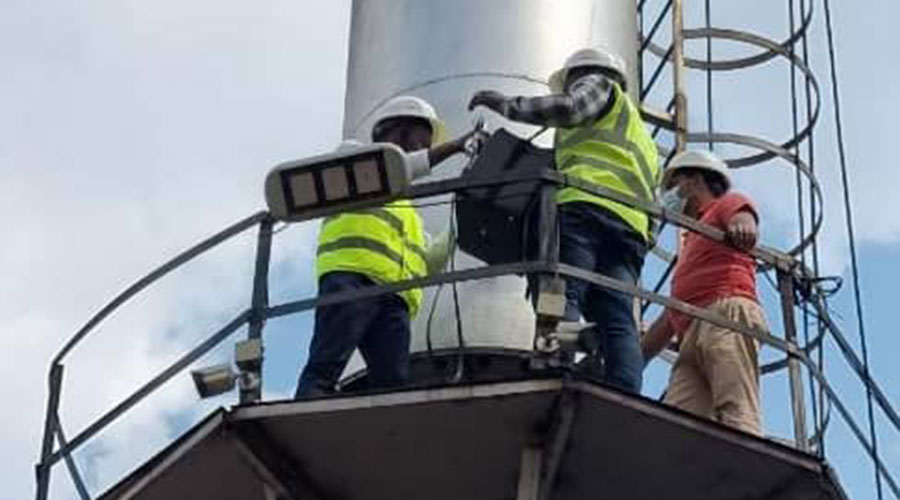 Technicians testing industrial emissions at SteelRwa in Rwamagana District.