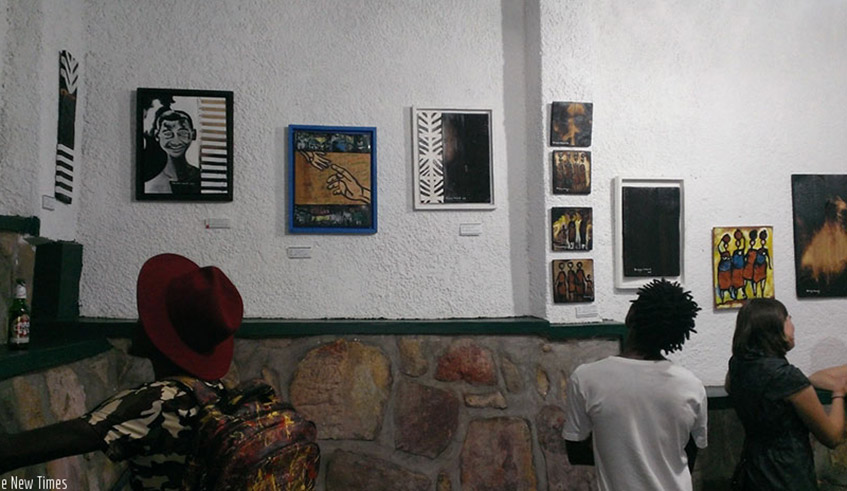 Guest during a apst exhibition in Kigali. Art can serve as therapy in a busy world. / File photo