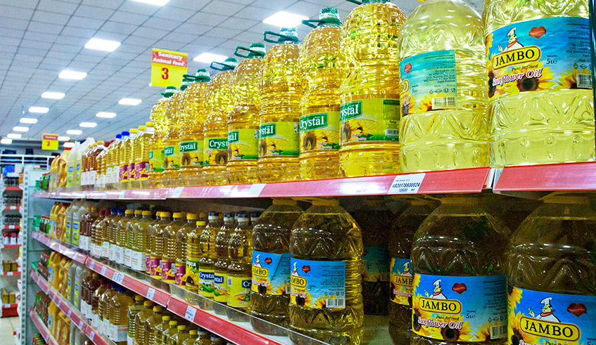 Imported cooking oil bottles on shelves in a supermarket in Kigali. / Photo: Dan Nsengiyumva.