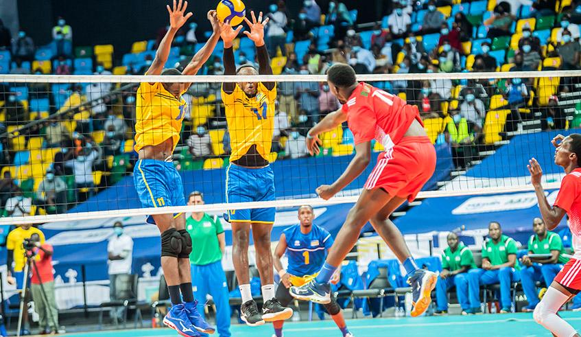The national volleyball team players block the ball during the match against Burundi, on Tuesday. Rwanda will face Burkina Faso on Thursday in their second game, at Kigali Arena. / Photo: Courtesy.
