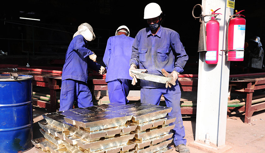 A worker stacks tin ingots at LuNa Smelter in Kigali. The firm is the sole producer and exporter of tin in both Eastern and Central Africa. / Photo: File.