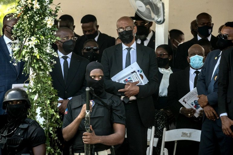 Prime Minister Ariel Henry (centre) at the funeral for assassinated Haitian President Jovenel Mou00efse, on July 23. The investigation into the killing has only deepened the country's political crisis. 