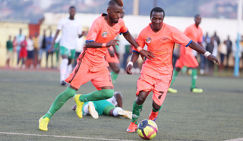 Gicumbi FC players with the ball during a past match against SC Kiyovu in 2019. Gicumbi is one of the favourites to win promotion to the top flight league as the second division league returns after 10 months. The league was suspended after the first round due to the rise in coronavirus cases. / Sam Ngendahimana.