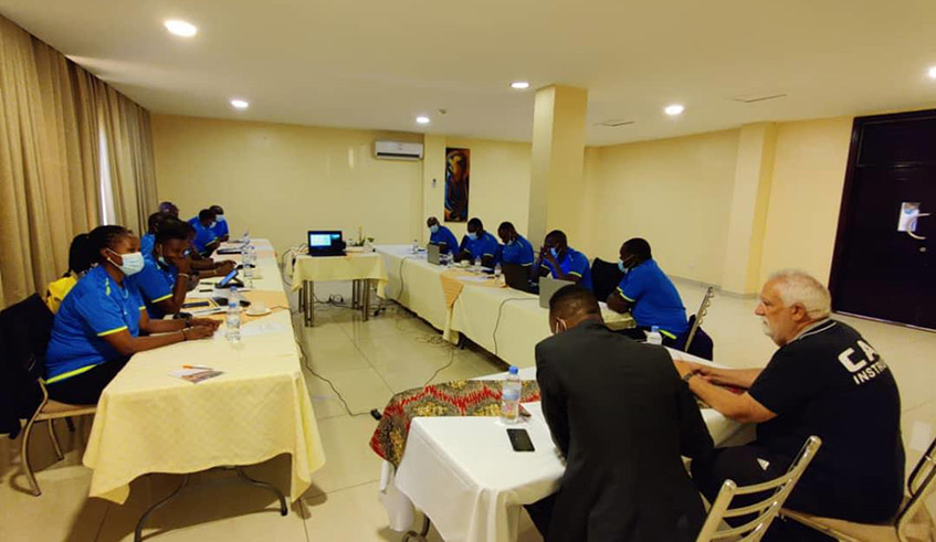 13 local football coaches undergoing  theoretical classes that are being conducted by CAF Instructors at Sainte Famille Hotel. / Courtesy.