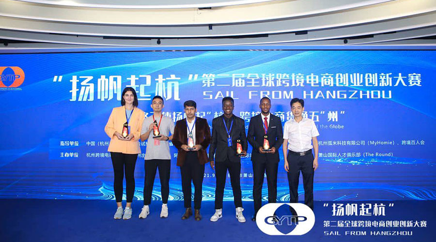 Rwandan students pose with officials during the awarding ceremony.