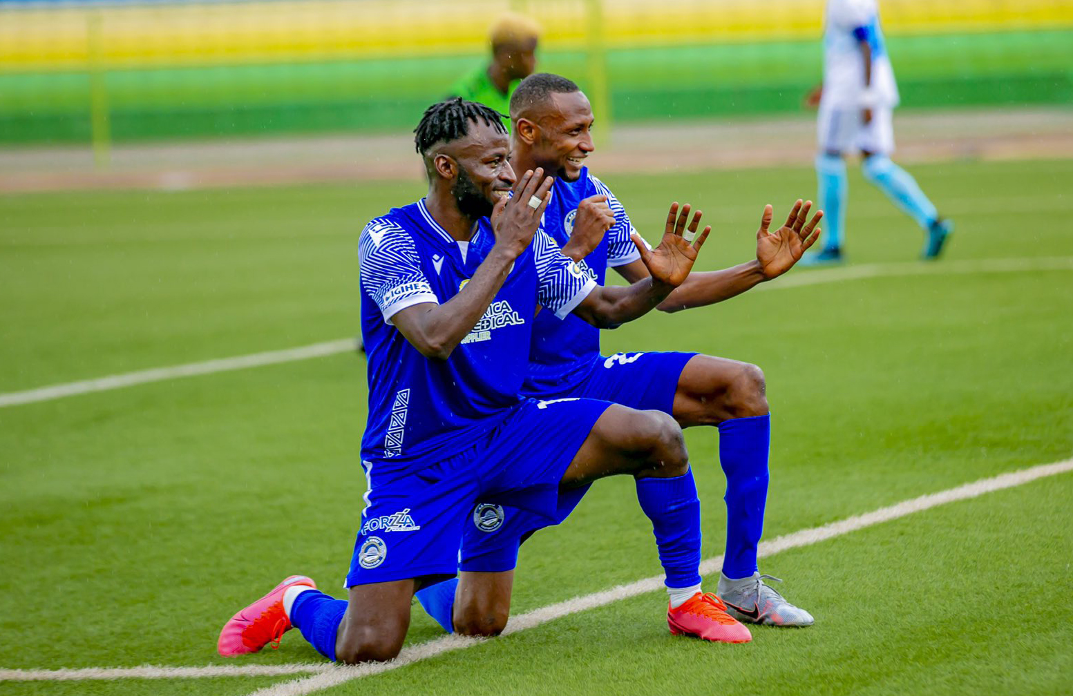 Shabalala celebrates his goal with his teammate during the match