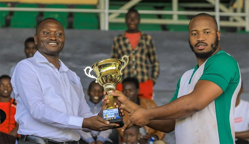 Rugby Federation President Tharcisse Kamanda hands over a trophy after the 2019 league title race. The 2021/22 Rugby league league is expected to return in October. / File.