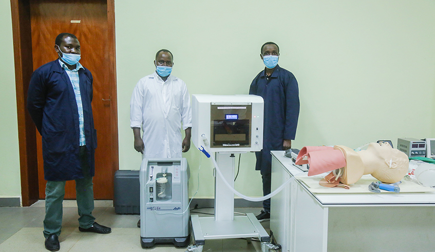 Joseph Habiyaremye, Costica Uwitonze and Jean Claude Udahemuka, Rwandan biomedical engineers from Integrated Polytechnic Regional Centre Kigali, with a prototype of the first locally produced ventilator to respond to Covid-19 pandemic. / Photo: Willy Mucyo.