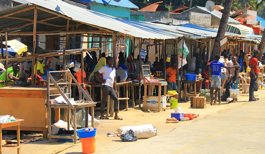 Residents reset their stalls at the roadside market after returning to their homes in Palma. 