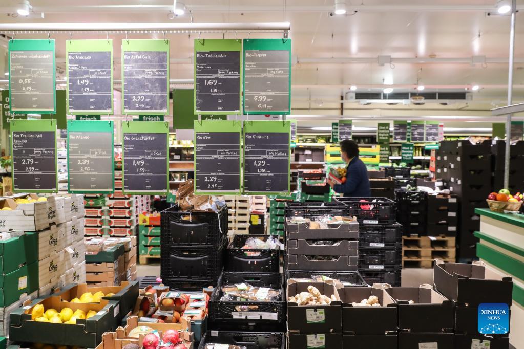 A customer shops for fruit and vegetables at a supermarket in Berlin, capital of Germany, on Oct. 1, 2021. 