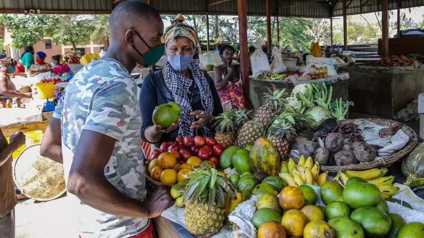A fruit vendor serves a customer at Kimihurura mini-market on July 23, 2021. Rwanda Civil Society Platform has recommended to managers of Covid-19 Economic Recovery Plan to design specific financial products for women. 