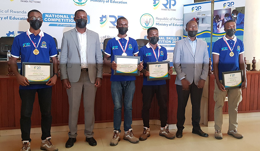 Golden awards: The four best winners (L-R) David Irimaso, Andru00e9 Ndayishimiye, Janvier Nizeyimana, and Elie Niyigena pose with officials at the closing of the National Skills Competition 2021 in Kigali on Thursday, October 7. They will represent Rwanda during the WorldSkills Africa 2022 competition in Swakopmund, Namibia next year. / Photo: Courtesy.
