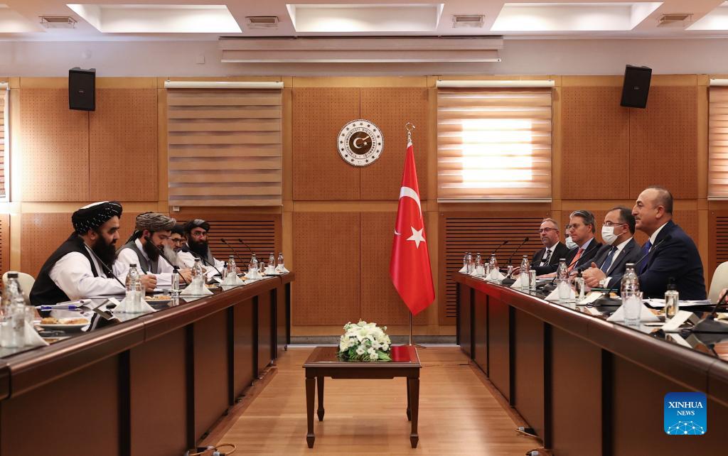 Turkish Foreign Minister Mevlut Cavusoglu (1st R) meets with Afghanistan's acting Foreign Minister Amir Khan Muttaqi (1st L) in Ankara, Turkey, on Oct. 14, 2021. 