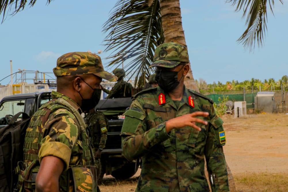 Maj Gen Innocent Kabandana, the joint task force commander of Rwandan troops in Mozambiqueu2019s northernmost province, Cabo Delgado, and Botswana's Brig Gen Dumisani Ndzinge, the deputy force commander of SAMIM, interact in Mocimboa da Praia on Wednesday.