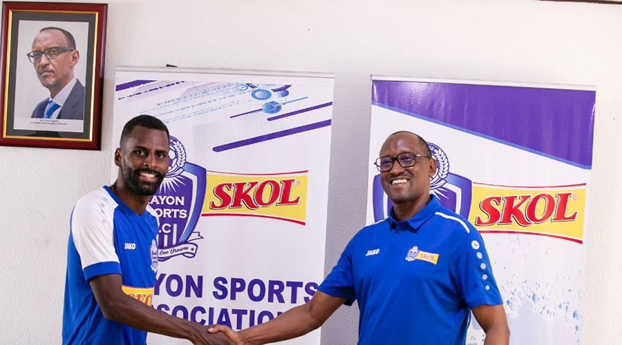 Brazilian forward Chrismar Malta Soares (L) smiles after signing the deal on October 17. 