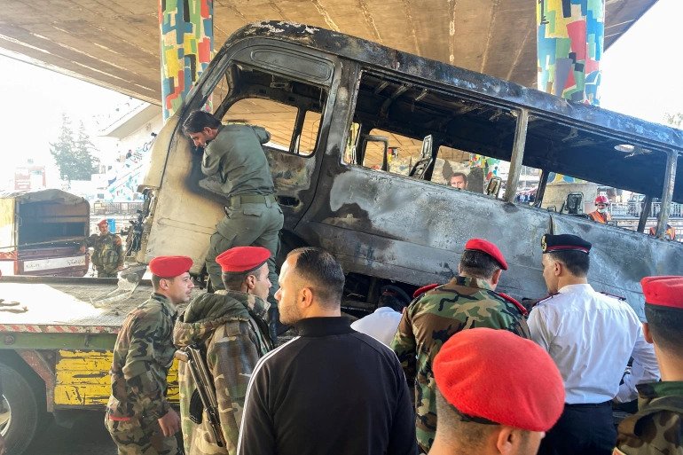 Military police inspect the site of an explosion in central Damascus. 