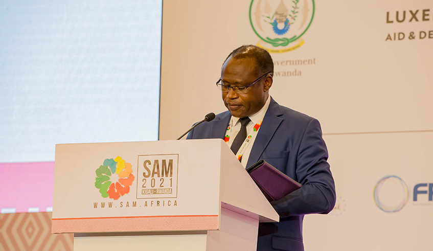 The Minister for Finance and Economic Planning, Uzziel Ndagijimana, delivers remarks during the five-day Africa Microfinance Week and Summit in Kigali, on Tuesday, October 19. / Photo: Courtesy.