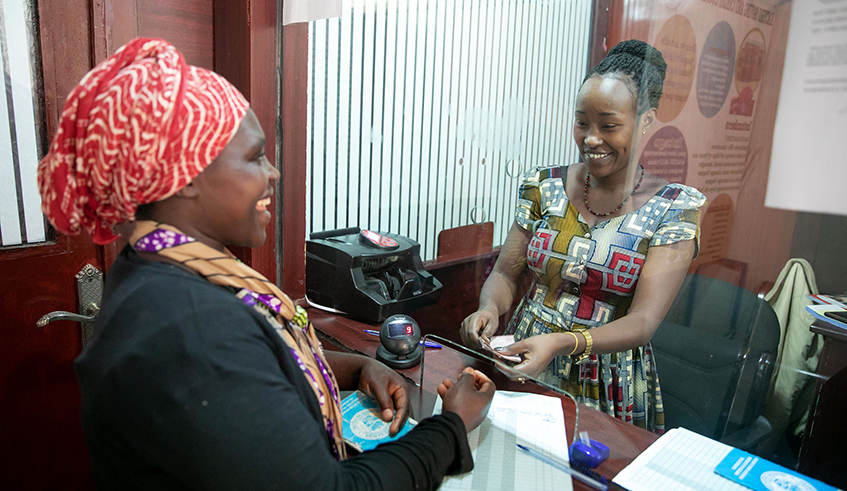 A teller serves a client at Kacyiru Savings and Credit Cooperative in Kigali on January 10, 2020. According to Aissa Touru00e9 Sarr, the Country Manager of African Development Bank in Rwanda, the continent will need at least $285 billion by 2025 in order to increase the ability of its population to access finance and deal with the effects of the Covid-19 pandemic. / Photo: File.