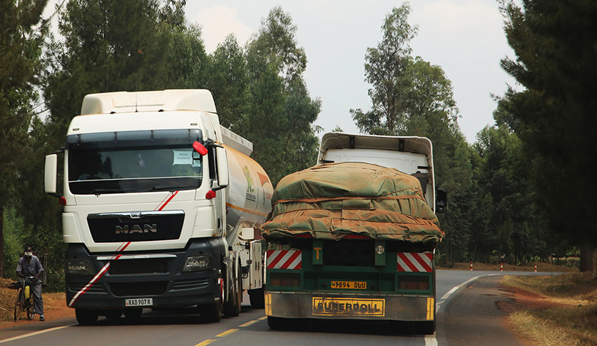 Cross-border cargo trucks transport goods on the Tanzania-Rwanda highway. As the African Continental Free Trade Area comes into effect, regional trade stakeholders have launched the MANSA, a source of data required to conduct due diligence on African entities; Financial Institutions, Corporates and SMEs. The digital platform provides a single primary source of Know-Your-Customer (KYC) data. / Photo: Craish Bahizi.