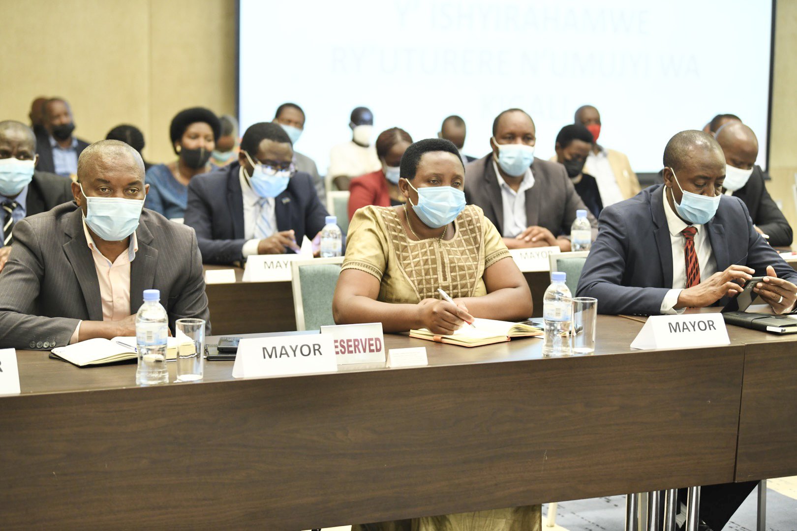 Mayors of districts follow a presentation during their meeting on October 24. 