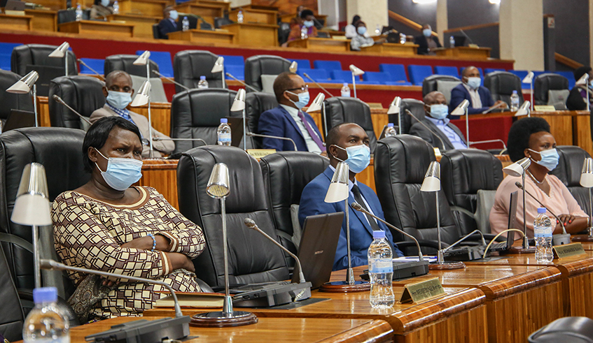 Members of parliament during a session last year . / Craish Bahizi