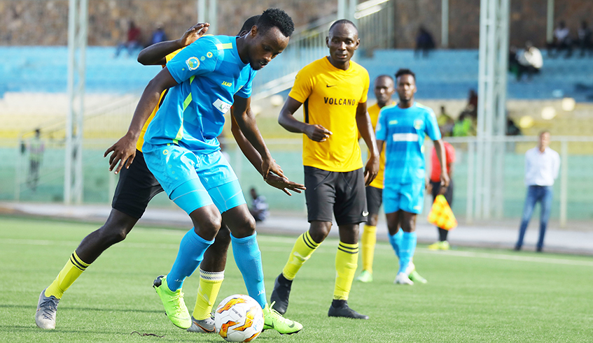AS Kigali midfielder Rashid Kalisa protects the ball from Mukura VS players during a past league match at Kigali stadium. The Rwanda premier league will kick off on October 30. / Photo:Sam Ngendahimana.