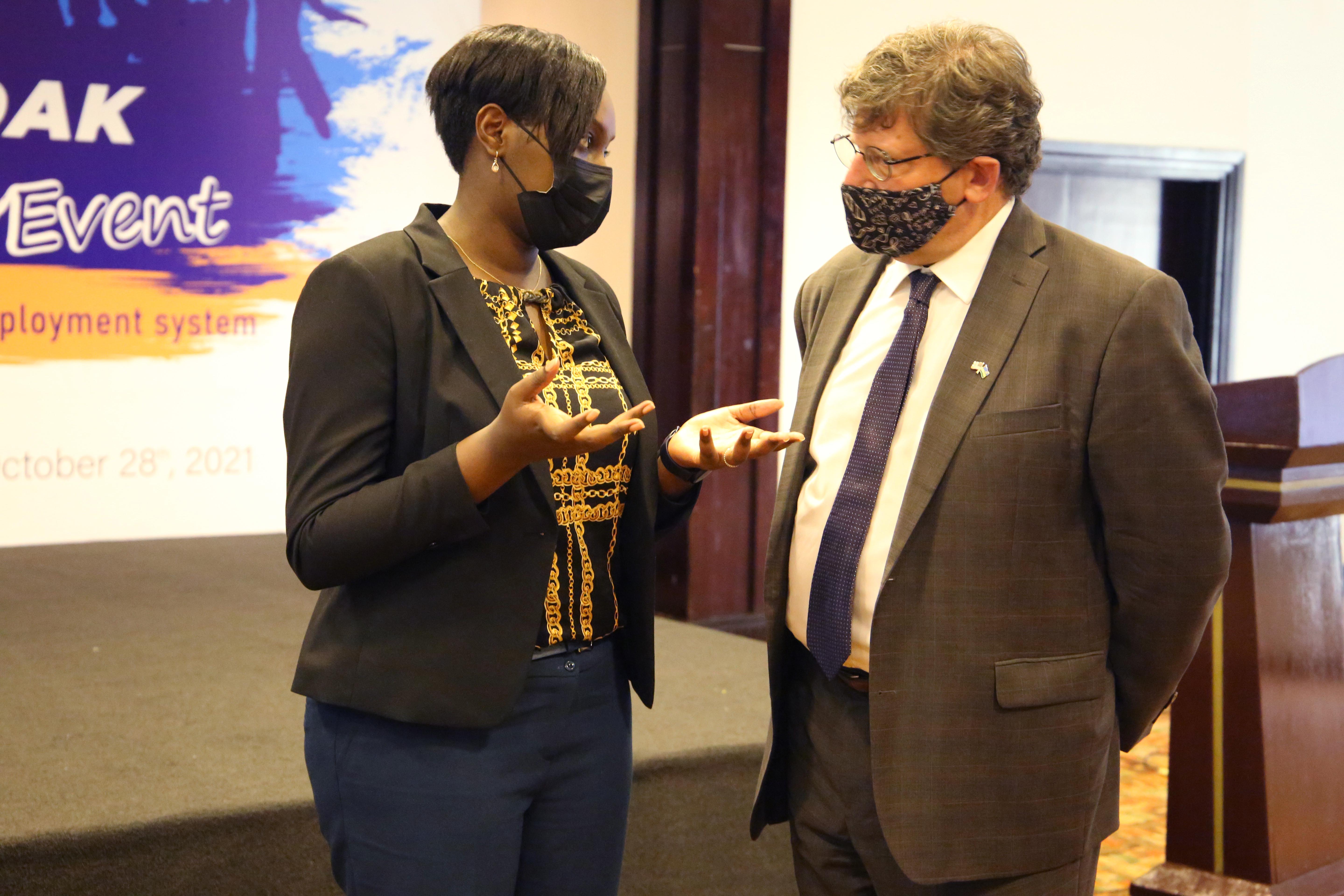 Minister of State in charge of ICT and TVET,Claudette Irere interacts with USAID Rwanda, Managing Director Jonathan Kamin during  the celebration of the USAID-funded Huguka Dukore Akazi Kanoze project on October 28. Craish Bahizi
