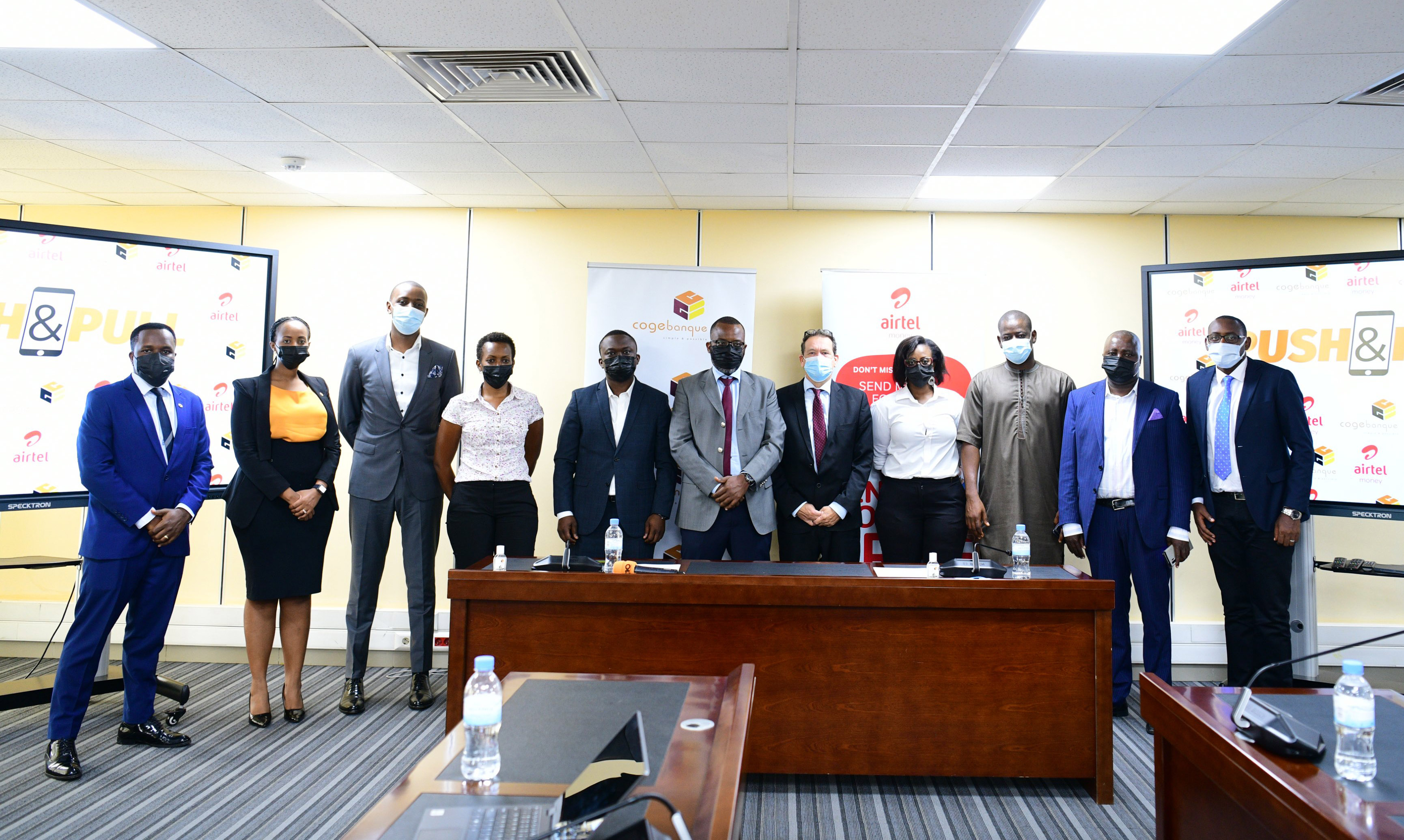 Officials pose for a group photo during the launch of the Push and Pull partnership between Airtel and Cogebanque on Thursday October 28. Courtesy.