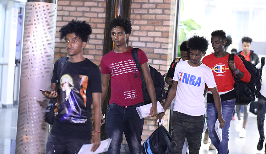 A group of asylum seekers from Libya on their arrival at Kigali International Airport in 2019 . / Sam Ngendahimana