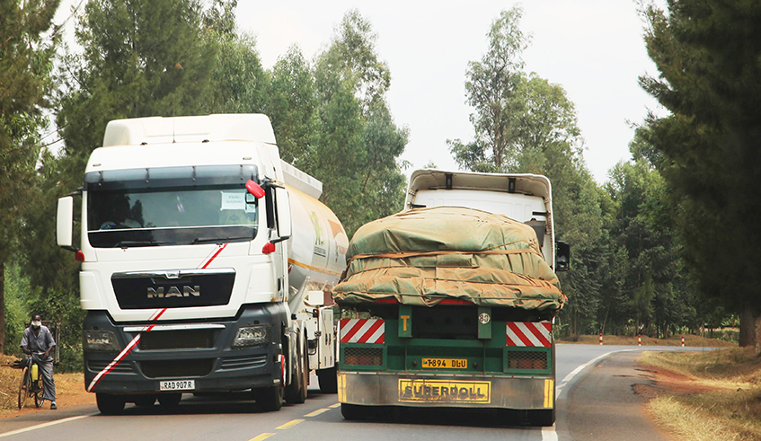 Cross border cargo trucks transport goods from Tanzania to Rwanda. The economies of Rwanda and 12 other countries in eastern Africa, are projected to collectively grow by 4.1 percent this year, up from 0.4 percent in 2020.  / Craish Bahizi
