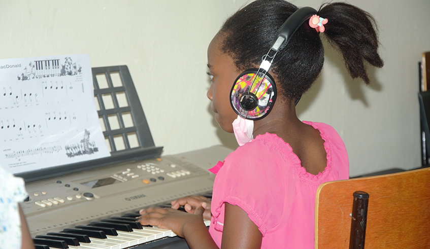  One of the students learning the piano.