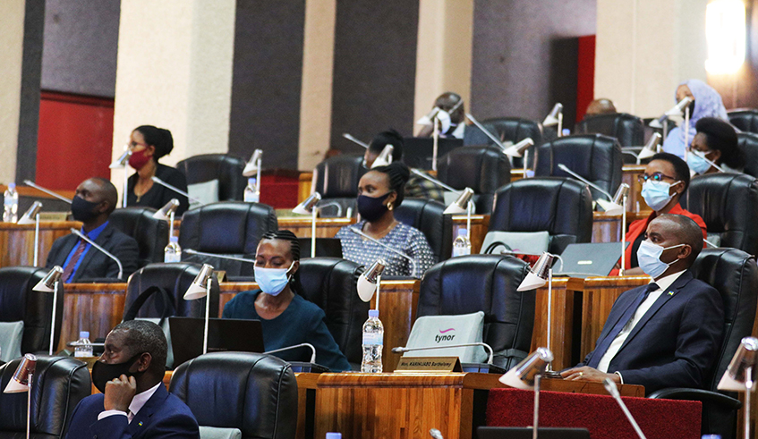 Members of parliament during a session in 2020 . / Craish Bahizi